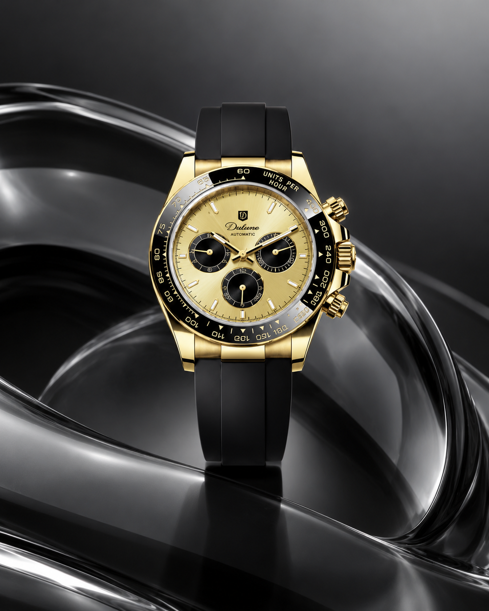Maison Dulune Automatic Rubber gold watch with black strap in a black sculptural glass scene.